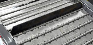 2 1/2" Pitch Hinged Steel Belt with Cleats Shown