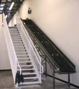 floor-to-floor-conveyor-next-to-stairs-installation