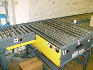 line-shaft-conveyor-system-with-pop-up-belt-transfer-section