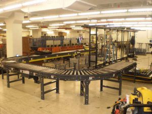 line shaft package handling system