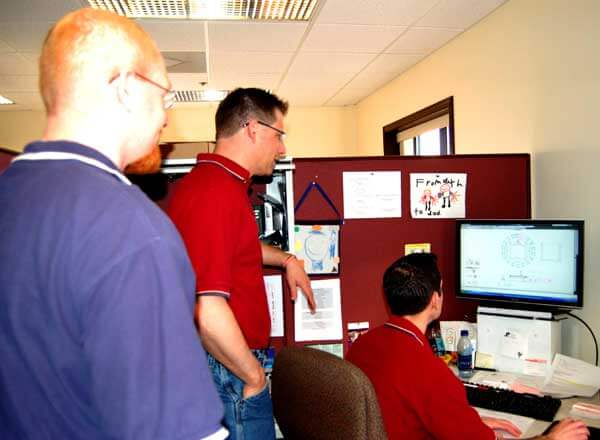 Titan Engineers discussing a custom conveyor system