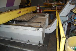 low-profile-hinged-steel-belt-conveyor-under-punch-press